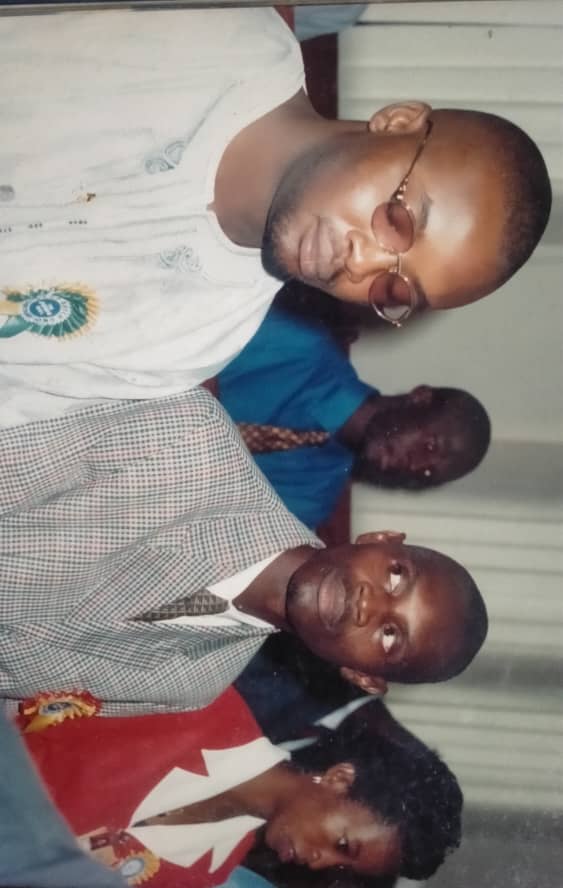 Who can guess the name of the trainee sitting behind and between Martins and Awusa?